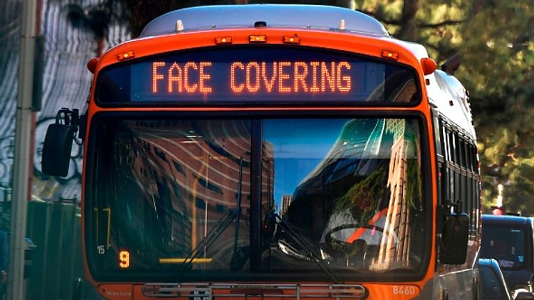 A health reminder on an LA bus as infections in the city saw a record-breaking surge