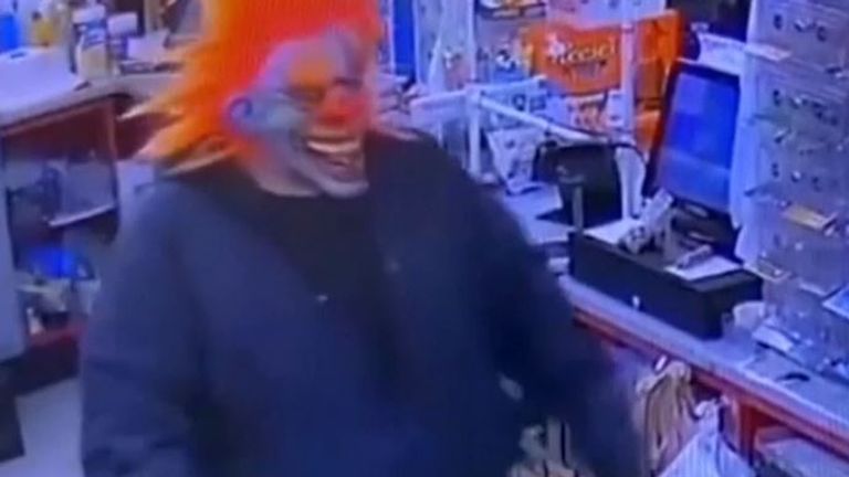 Police seek man who threatened a shop worker with a knife while wearing a clown mask