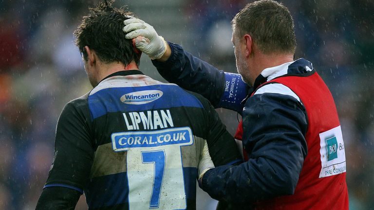 Michael Lipman receives treatment for a head injury while playing for Bath in 2009