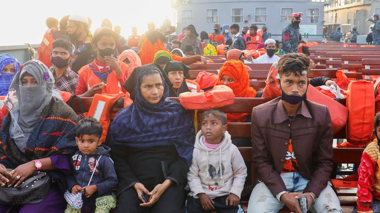 Rohingyas refugees sit on board a navy ship to move to Bhasan Char island in Chattogram
