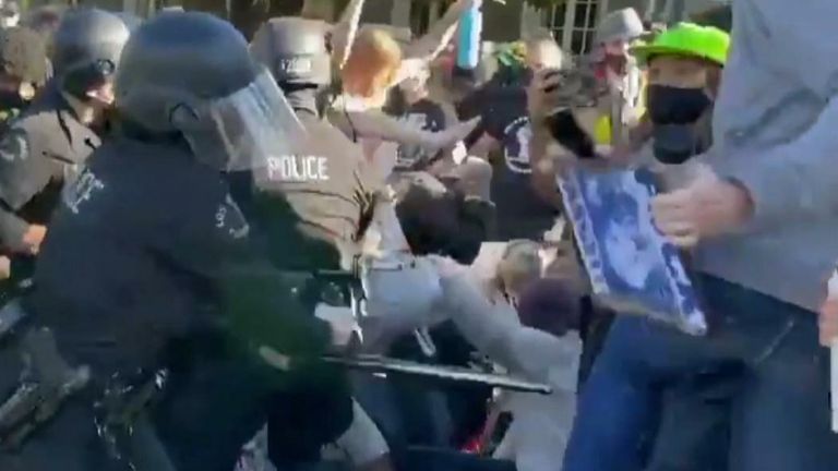 Police and protesters clash at LA mayor house