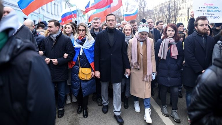 Navalny is pictured with Sobol (L) and his wife Yulia on a march in Moscow earlier this year