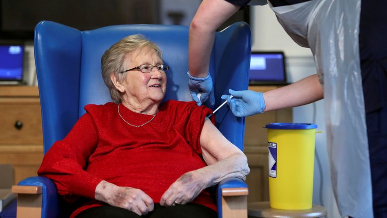 Annie Innes, 90, receives the Pfizer/BioNTech COVID-19 vaccine at the Abercorn House Care Home in Hamilton, Scotland on 14 December