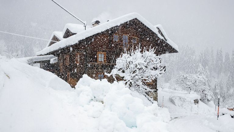 A house is seen in a landscape covered in snow in Kals am Grossglockner in East Tyrol on December 6, 2020. - The continuing heavy snowfall and storms in the mountains have further increased the danger of avalanches in East Tyrol. The Avalanche Warning Service Tyrol announced level "5", the highest danger level, for Sunday, December 6, 2020. (Photo by Johann GRODER / various sources / AFP) / Austria OUT (Photo by JOHANN GRODER/EXPA/AFP via Getty Images)
