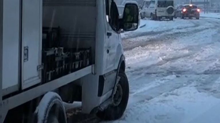 Milk float struggles to move on icy road