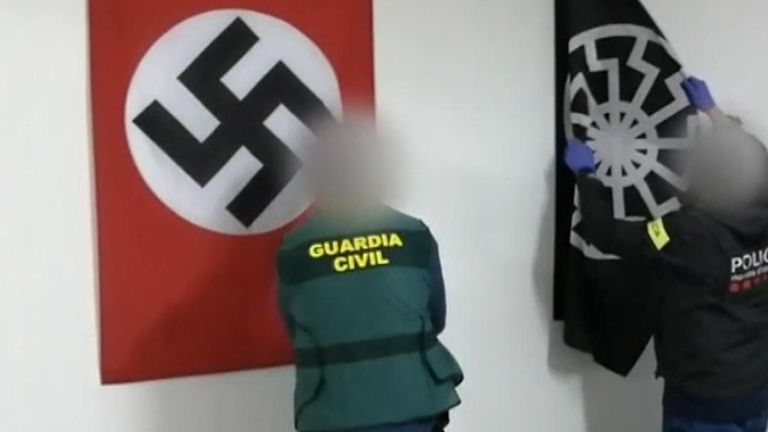 Two men have been arrested in Spain for financing the arming of a future &#34;race war&#34;.