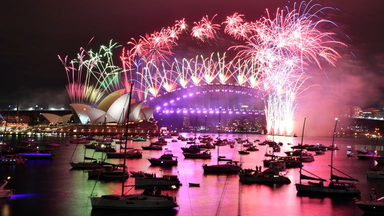 Fireworks explode over the Sydney Opera House and Sydney Harbour Bridge 