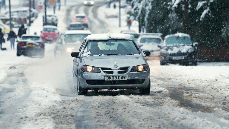 STOURBRIDGE, ENGLAND - DECEMBER 28: A car wheel turns in the snow as heavy snow falls in the West Midlands overnight on December 28, 2020 in Stourbridge, England.  Heavy snow covered the West Midlands as the Met Office issues yellow warnings throughout the day.  (Photo by Cameron Smith / Getty Images)