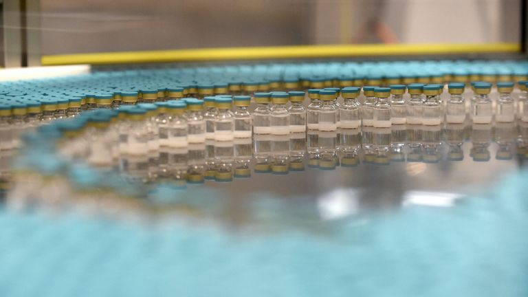 View of vials on a production line at the factory of British multinational pharmaceutical company GlaxoSmithKline (GSK) in Saint-Amand-les-Eaux, northern France, on December 3, 2020, where the adjuvant for Covid-19 vaccines will be manufactured. - Canada&#39;s Medicago and British pharmaceutical giant GlaxoSmithKline (GSK) announced on December 3, 2020 the launch of phase 2 and 3 clinical trials on a Covid-19 vaccine, one of a series of candidates being developed worldwide. Final phase 3 trials of t