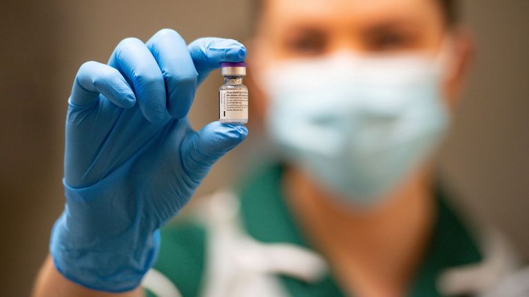 A nurse holding the Pfizer/BioNTech COVID-19 vaccine in Coventry