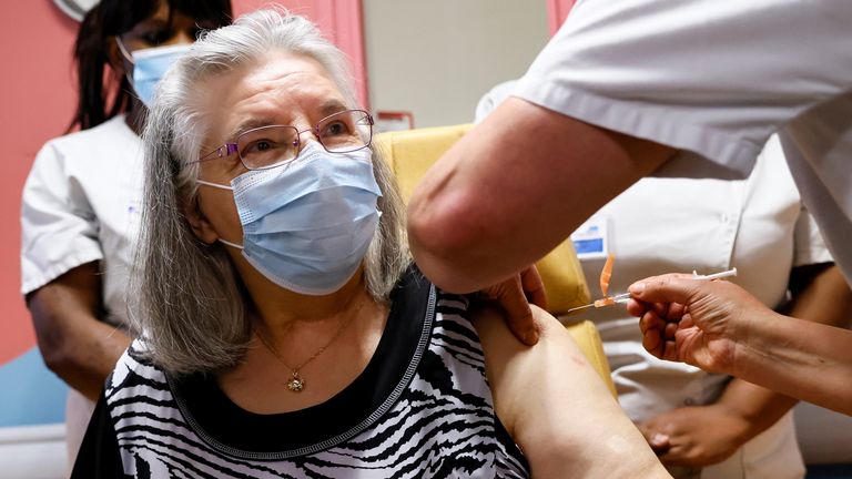 Mauricette, a 78-year-old French woman, receives the first dose of the Pfizer-BioNTech coronavirus disease (COVID-19) vaccine in the country, at the Rene-Muret hospital in Sevran, on the outskirts of Paris, France, December 27, 2020. Thomas Samson/Pool via REUTERS