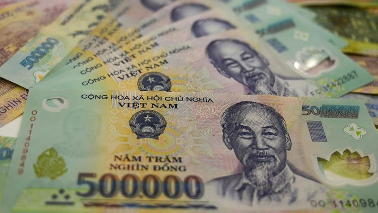 This photo illustration shows the highest denomination Vietnamese dong banknotes in Hanoi on May 21,2019