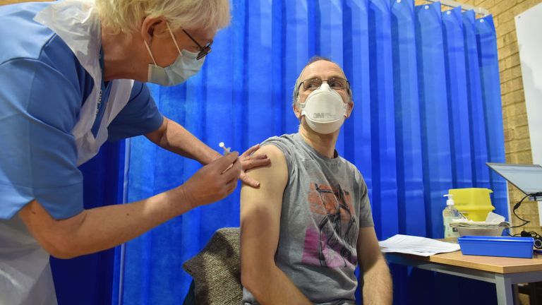 A man in Wales becomes one of the first people in the UK to receive the coronavirus jab