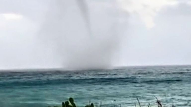 A waterspout swirled off the coast of Roccella Ionica, Italy, on December 5