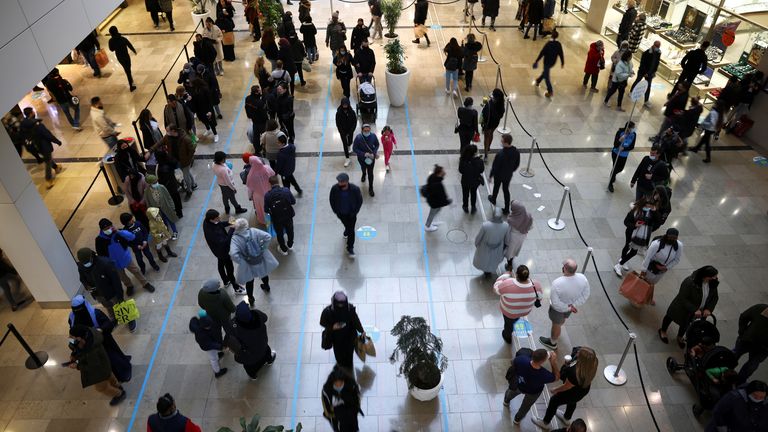People queue inside the Westfield Stratford City shopping centre, amid the coronavirus disease (COVID-19) outbreak in London, Britain, December 5, 2020. REUTERS/Henry Nicholls