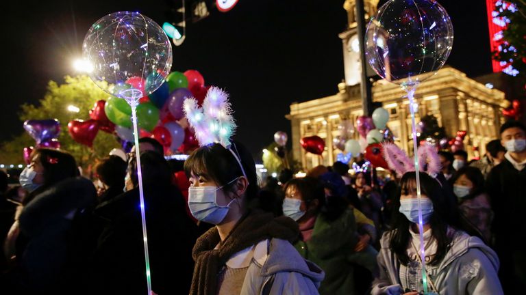 New Year&#39;s Eve celebrations in Wuhan
Women hold light balloons as people gather to celebrate the arrival of the new year during the coronavirus disease (COVID-19) outbreak in Wuhan, China December 31, 2020. REUTERS/Tingshu Wang