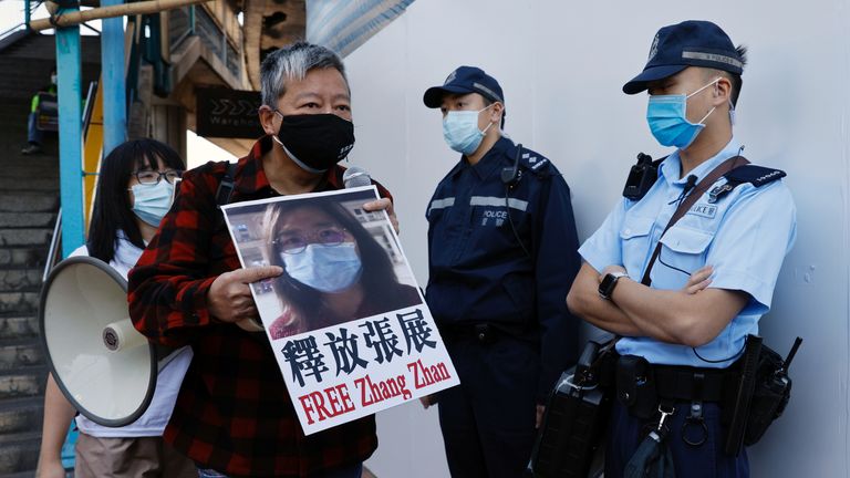 Pro-democracy supporters protest to urge for the release of 12 Hong Kong activists arrested as they reportedly sailed to Taiwan for political asylum and citizen journalist Zhang Zhan outside China&#39;s Liaison Office, in Hong Kong, China December 28, 2020. REUTERS/Tyrone Siu
