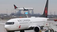 An Air Canada Boeing 737 MAX 8 from San Francisco approaches for landing at Toronto Pearson International Airport over a parked Air Canada Boeing 737 MAX 8 aircraft in Toronto, Ontario, Canada, March 13, 2019