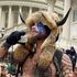 Horn-wearing QAnon 'shaman' arrested and charged over pro-Trump riots at Capitol