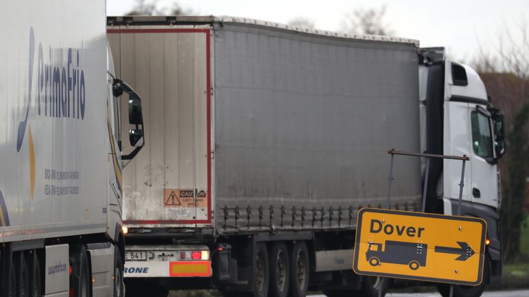 A lorry passes a Dover sign as it makes it's way into the lorry park at Manston Airport, Kent, after France imposed a 48-hour ban on entry from the UK in the wake of concerns over the spread of a new strain of coronavirus.
