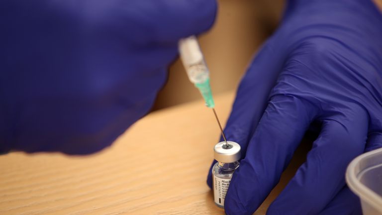 A nurse prepares the BioNTech/Pfizer Covid-19 vaccine for doctors to inject into elderly residents arms at Bowbrook House care home in Shrewsbury. Picture date: Wednesday January 20, 2021.