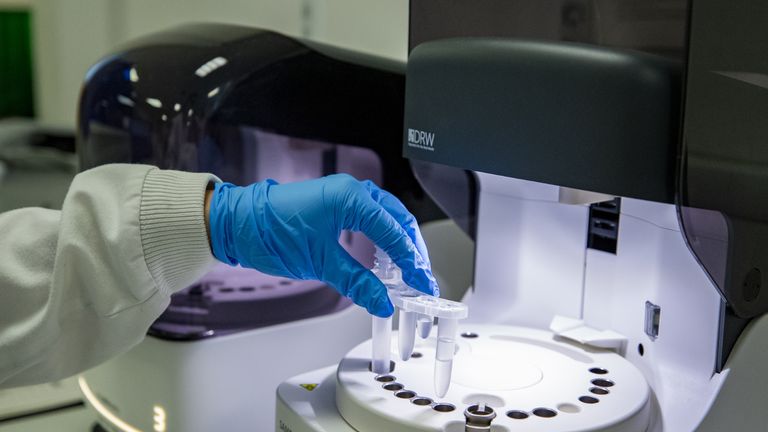 Lydia Newhall, a trainee biomedical scientist (BMS) in pathology, prepares Covid-19 tests for analysis in the laboratory at Whiston Hospital in Merseyside.