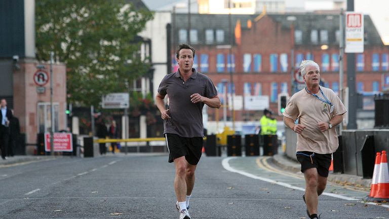 Conservative party leader David Cameron (left) goes for an early morning run with MP Desmond Swayne ahead of his speech at his party's conference in Manchester.