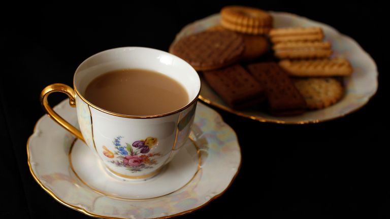 A cup of tea and plate of biscuits