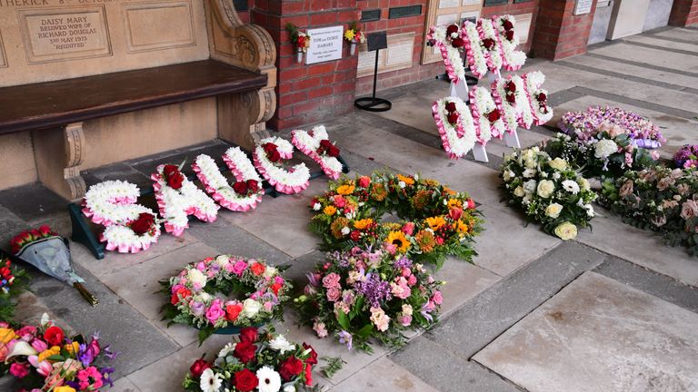 Flowers spell out &#39;Saucy&#39; and &#39;The Dame&#39; in honour of the star