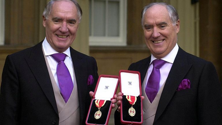 Sir David Barclay (l) and his twin brother Sir Frederick after receiving their knighthoods at Buckingham Palace in 2000