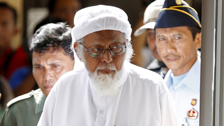 Indonesian radical Muslim cleric Abu Bakar Bashir enters a courtroom for the first day of an appeal hearing in Cilacap, Central Java province