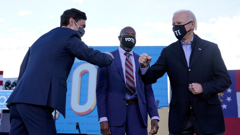 Joe Biden (R) campaigns for Senate candidates Raphael Warnock (C) and Jon Ossoff (L)                