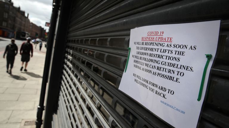 A sign on the shutters of a business premises in Edinburgh as the UK continues in lockdown to help curb the spread of the coronavirus