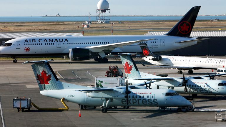 FILE PHOTO: Air Canada airplanes are pictured at Vancouver&#39;s international airport in Richmond, British Columbia, Canada, February 5, 2019