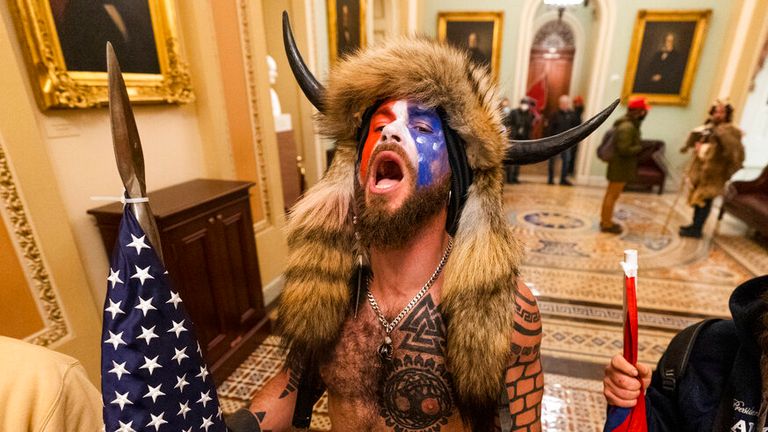 A supporter of President Donald Trump chants outside the Senate Gallery inside the Capitol                                                                                          