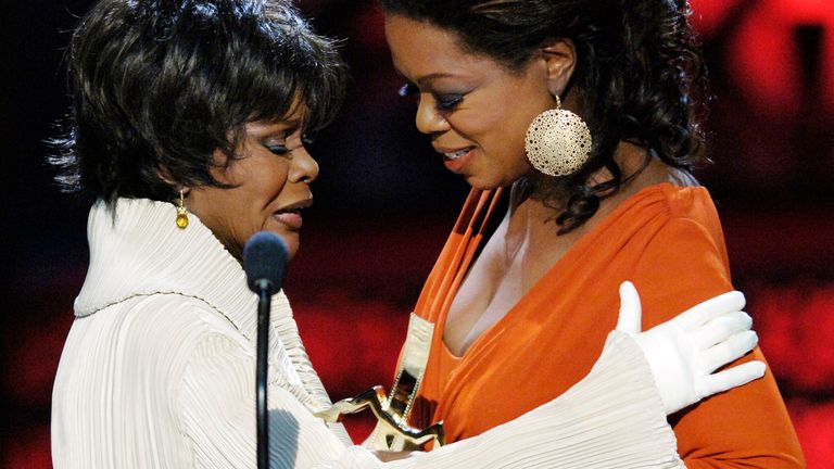 Oprah Winfrey (R) presents the Distinguished Career Achievement award to actress Cicely Tyson at the 2006 Black Movie Awards in Los Angeles