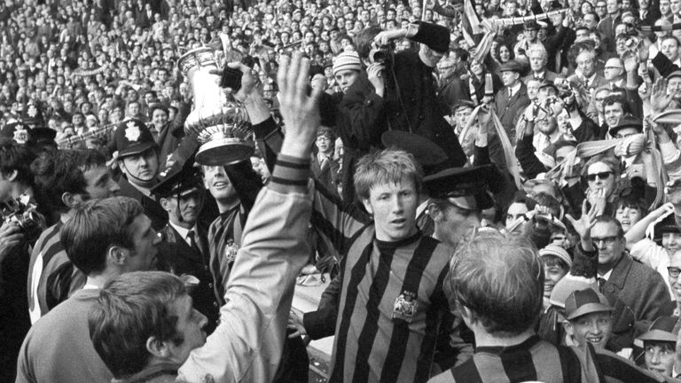 File photo dated 26-04-1969 of Manchester City&#39;s Colin Bell holds up the FA Cup with teammates in front of the Manchester City fans at Wembley Stadium after beating Leicester City 1-0..
