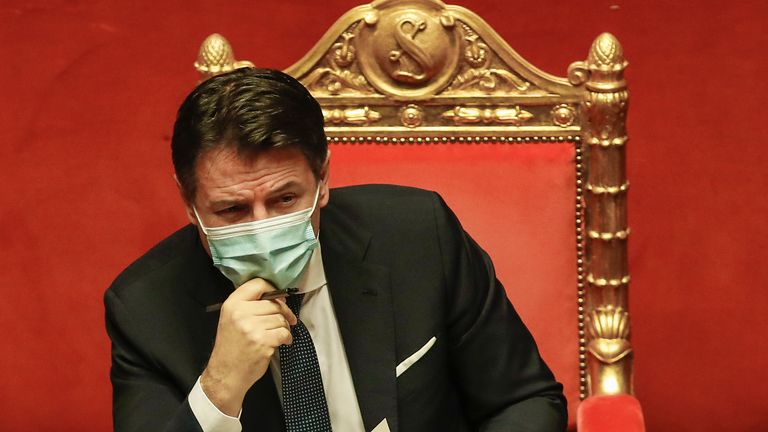 Premier Giuseppe Conte attends a debate at the Senate prior to a confidence vote, in Rome, Tuesday, Jan. 19, 2021. Conte fights for his political life with an address aimed at shoring up support for his government, which has come under fire from former Premier Matteo Renzi's tiny but key Italia Viva (Italy Alive) party over plans to relaunch the pandemic-ravaged economy. (AP Photo/Alessandra Tarantino, pool)