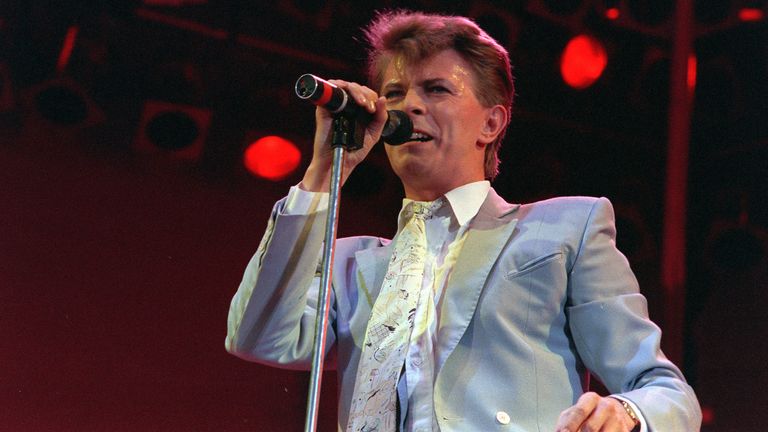 Rock star David Bowie performs on stage at Wembley Stadium, London, July 13, 1985, during the Live Aid famine relief rock concert. (AP Photo/Joe Schaber)