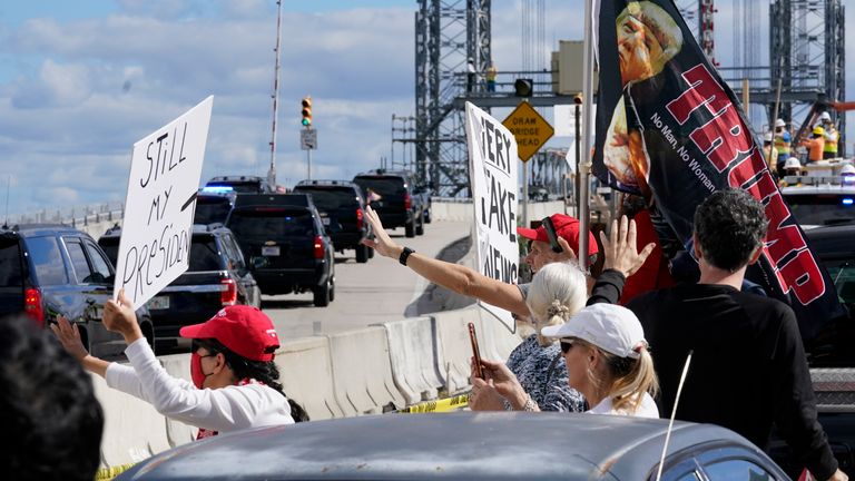Trump supporters waved at his motorcade as he travelled to his Mar-a-Lago resort. Pic: AP