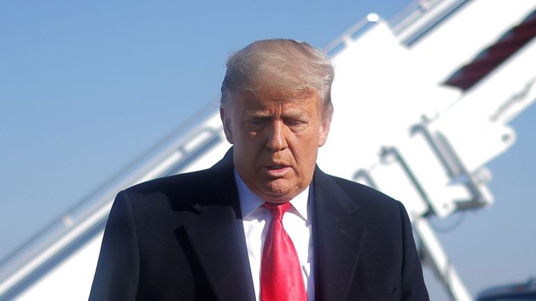 U.S. President Donald Trump walks to speak to the media before boarding Air Force One to depart Washington on travel to visit the U.S.-Mexico border Wall in Texas, at Joint Base Andrews in Maryland, U.S., January 12, 2021. REUTERS/Carlos Barria
