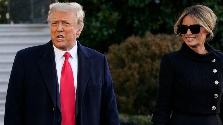 President Donald Trump and first lady Melania Trump stop to talk with the media as they walk to board Marine One on the South Lawn of the White House. Pic: AP