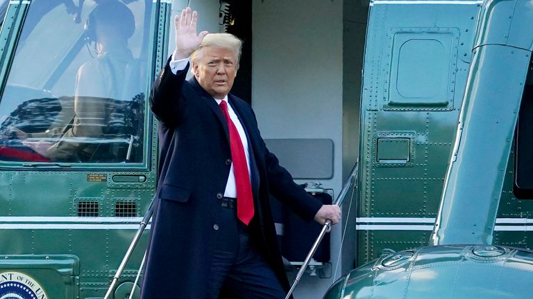 President Donald Trump waves as he boards Marine One and leaves the White House
