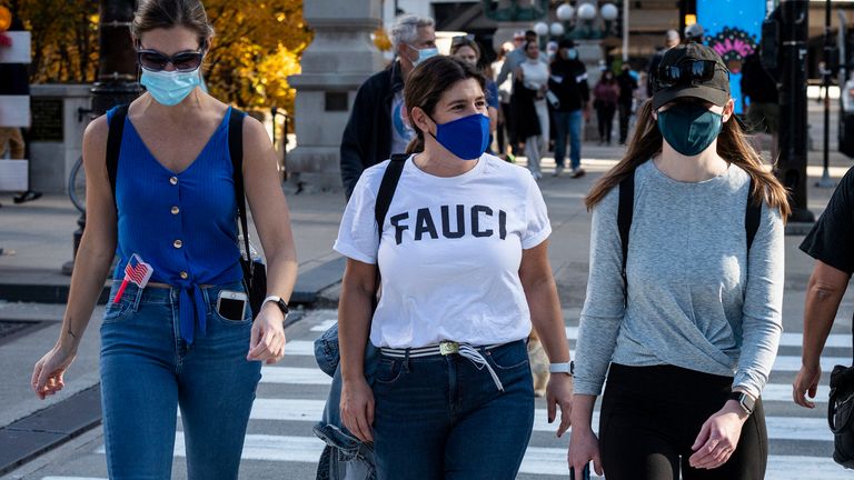 A pedestrian wears a t-shirt bearing the name of Dr. Anthony Fauci after the election of Joe Biden as the 46th President of the United States on Saturday November 7, 2020 in Chicago, IL. (Photo by Christopher Dilts / Sipa USA)