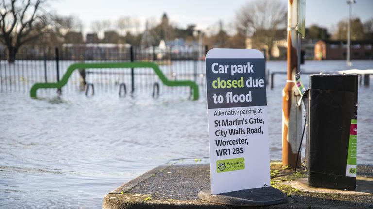 A flooding sign at the flooded Pitchcroft Car Park in Worcester, Worcestershire, where the River Severn continues to rise after several days of heavy rain. Several flood warnings and alerts along the River Severn have been issued.