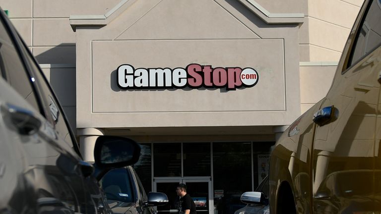 A man walks past a GameStop store in Austin, TX, U.S., March 26, 2018