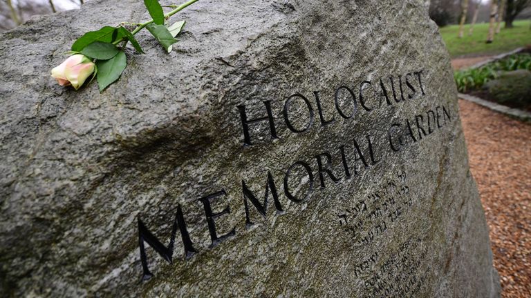 A rose is placed on the stone in the Holocaust Memorial Garden in Hyde Park, London, to help mark Holocaust Memorial Day. Picture date: Wednesday January 27, 2021.
