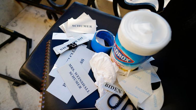 AP PIC: Placards and Clorox are available ahead of President-elect Joe Biden&#39;s inauguration ceremony, Wednesday, Jan. 20, 2021, in Washington.(Melina Mara/The Washington Post via AP, Pool)