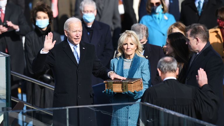 (210120) -- WASHINGTON, Jan. 20, 2021 (Xinhua) -- U.S. President-elect Joe Biden (L, Front) is sworn in as the 46th President of the United States in Washington, D.C., the United States, on Jan. 20, 2021. At an unusual inauguration closed to public due to the still raging coronavirus pandemic, U.S. President-elect Joe Biden was sworn in as the 46th President of the United States on Wednesday at the West Front of the Capitol, which was breached two weeks ago by violent protesters AP pic