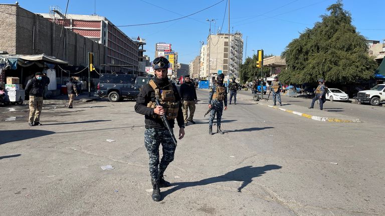 Iraqi security forces keep guard the site of a suicide attack in Baghdad, Iraq January 21, 2021. 